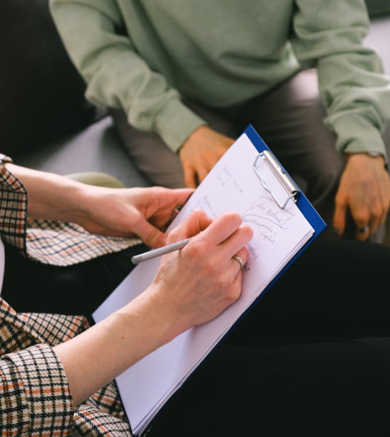 a therapist taking notes
