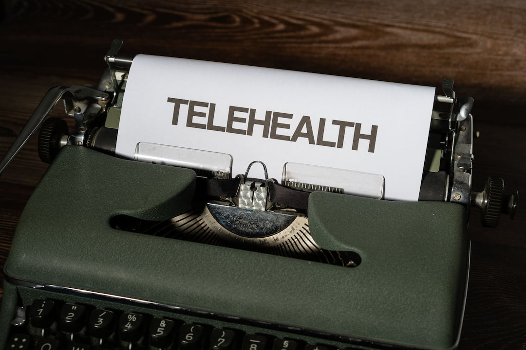 picture of typewriter with Telehealth on paper